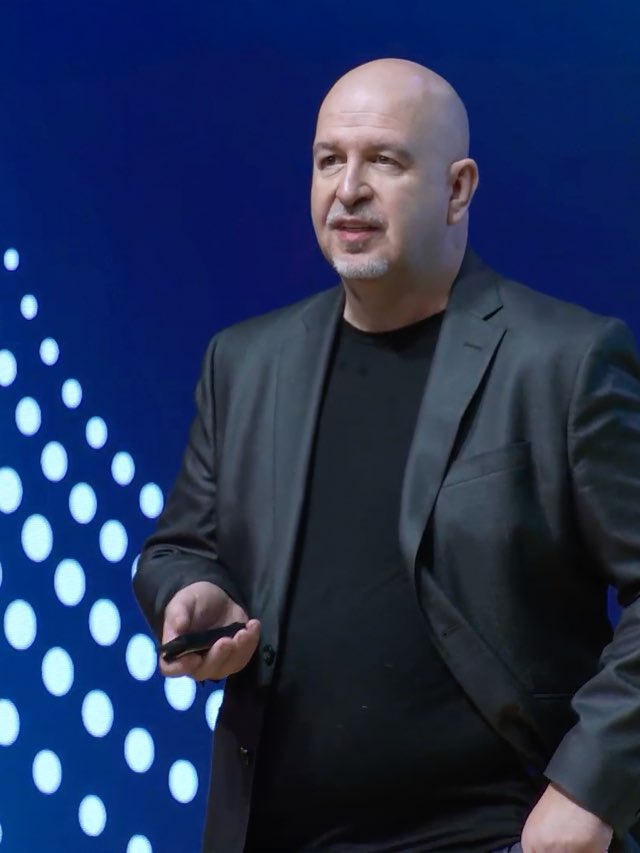 Anthony Maley speaking on stage